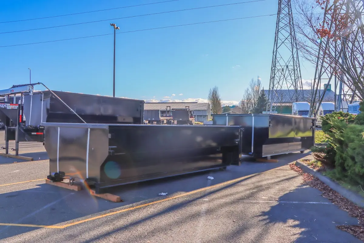 Roll-off dumpster ready for waste disposal at job site for 12 Yard Dumpster Rental in Bastrop